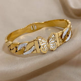 Bracelet papillon doré avec strass pour femmes.